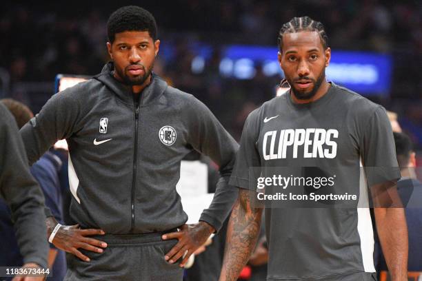 Los Angeles Clippers Guard Paul George and Los Angeles Clippers Forward Kawhi Leonard look on before a NBA game between the Boston Celtics and the...