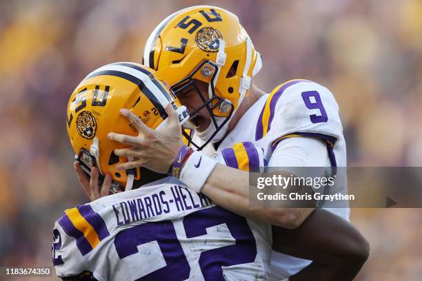 Quarterback Joe Burrow of the LSU Tigers celebrates after a touchdown with running back Clyde Edwards-Helaire of the LSU Tigers against the Auburn...