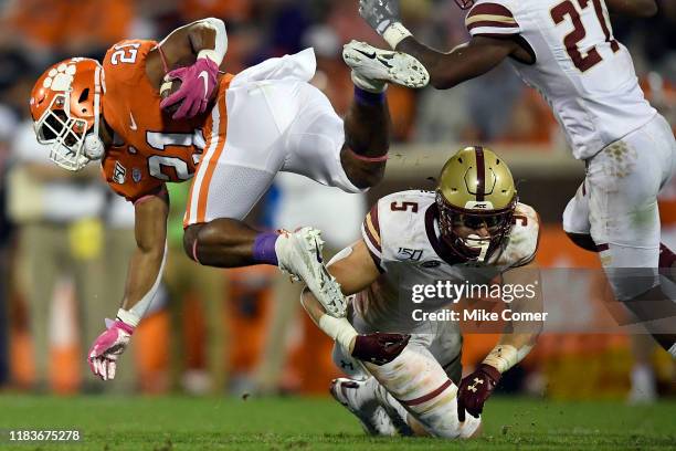 Defensive back Nolan Borgersen of the Boston College Eagles tackles running back Darien Rencher of the Clemson Tigers during their football game at...