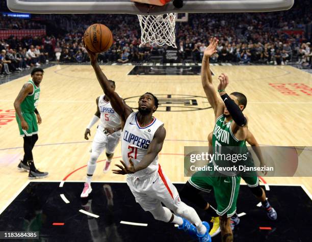 Patrick Beverley of the Los Angeles Clippers scores a basket against Jayson Tatum of the Boston Celtics during the first half at Staples Center on...