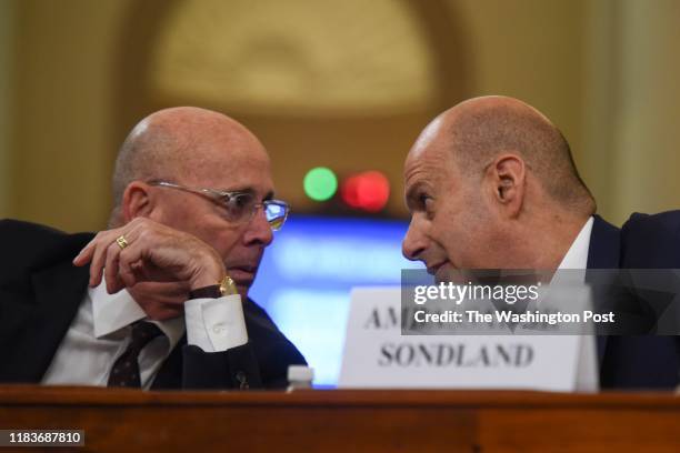 Attorney Robert Luskin, L, confers with Gordon Sondland, the U.S. Ambassador to the European Union, as Sondland prepares to testify before the House...