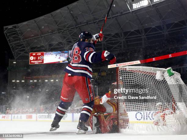 Bryan Little of the Winnipeg Jets reacts after scoring the game-winning goal against goaltender David Rittich of the Calgary Flames in overtime of...