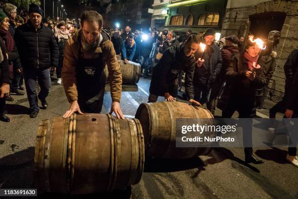 Traditional torchlight march followed by the breakthrough of the first barrel of Beaujolais Nouveau wine in Lyon, France, on November 21, 2019. A...