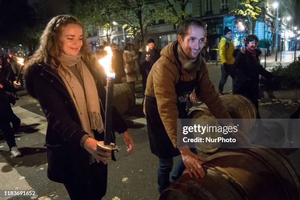 Traditional torchlight march followed by the breakthrough of the first barrel of Beaujolais Nouveau wine in Lyon, France, on November 21, 2019. A...