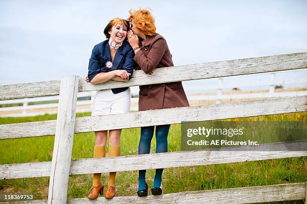 girls on fence - petaluma stock pictures, royalty-free photos & images