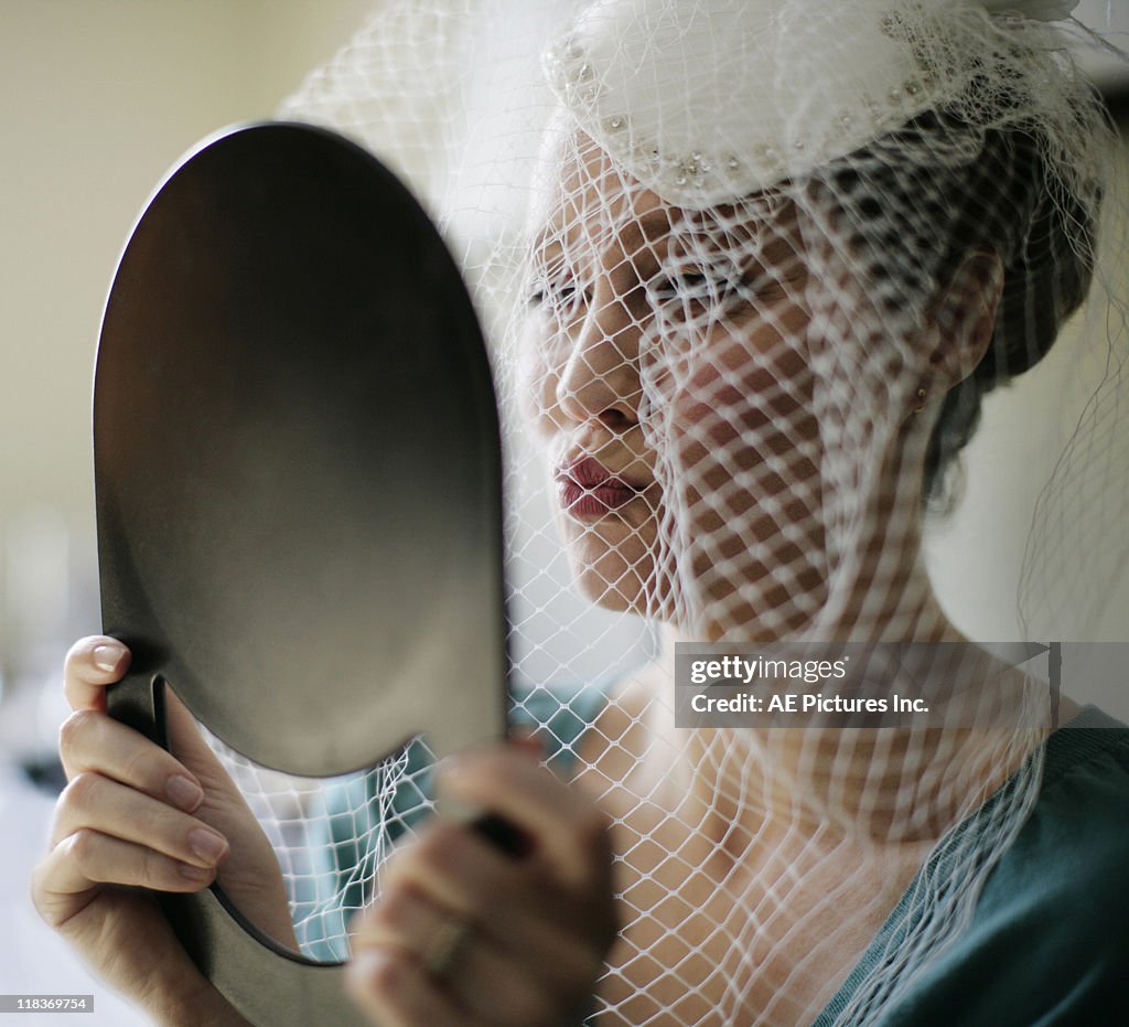 Bride under cage veil
