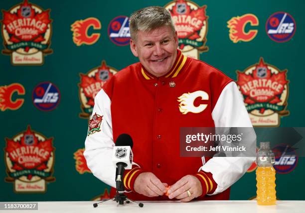 Head coach Bill Peters of the Calgary Flames speaks at the post game press conference after the 2019 Tim Hortons NHL Heritage Classic between the...