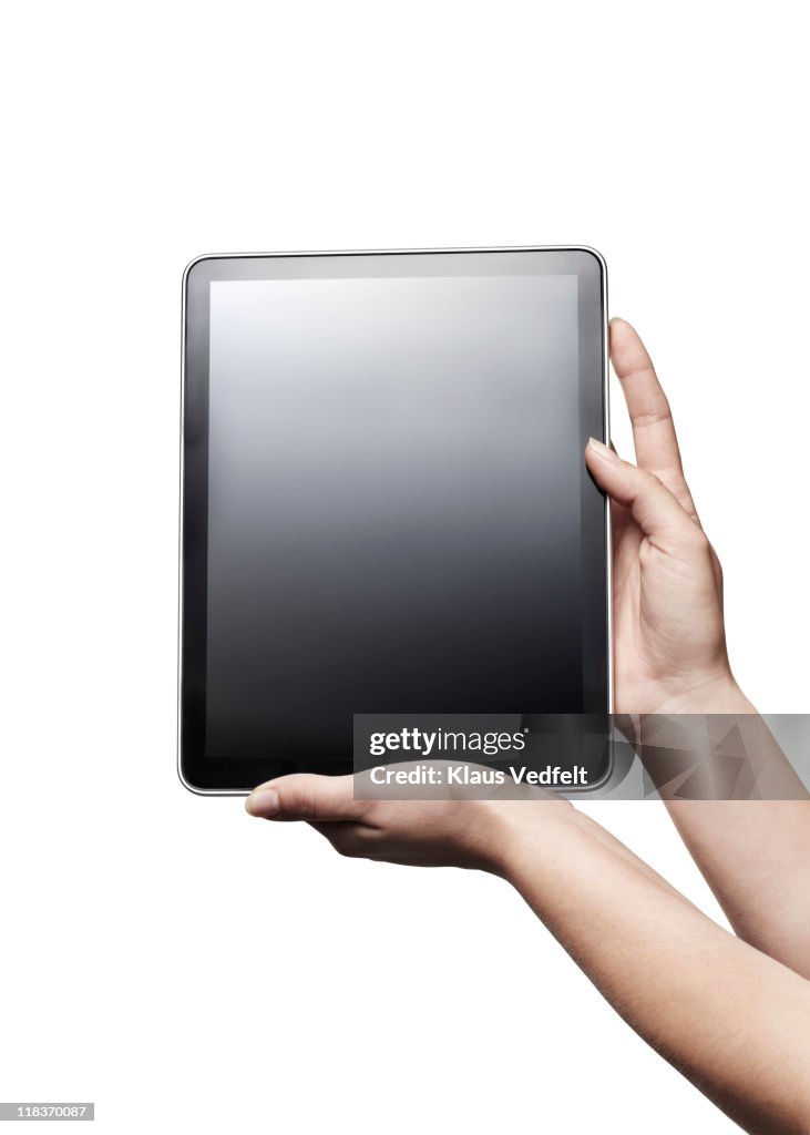 Closeup of hands holding  tablet