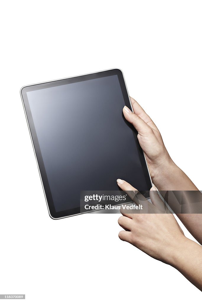 Closeup of hands holding  tablet