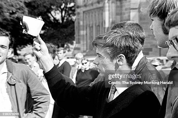 University students burn draft cards in protest against the war in Vietnam, 7 May 1968.