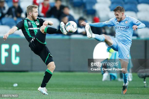 Connor Pain of Western United and Craig Noone of Melbourne City contest the ball during the round three A-League match between Western United and...