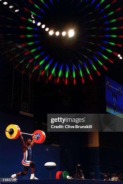 Samson N''Dicka Matam of France lifts during the Mens 62 kilogram Weightlifting Clean and Jerk event at the Sydney Convention and Exhibition Centre...