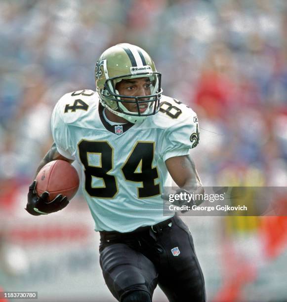 Kick returner/punt returner Michael Lewis of the New Orleans Saints runs with the football against the Buffalo Bills during a game at Ralph Wilson...