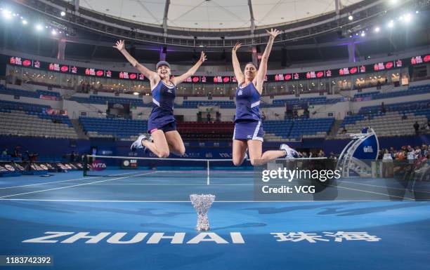 Lyudmyla Kichenok of the Ukraine and Andreja Klepac of Slovenia celebrate with the trophy after winning the Women's Doubles final match against Duan...