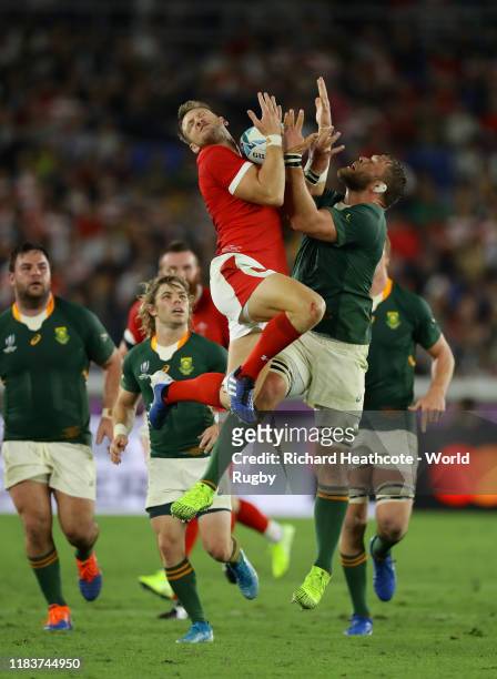 Dan Biggar of Wales jumps with Duane Vermeulen of South Africa during the Rugby World Cup 2019 Semi-Final match between Wales and South Africa at...