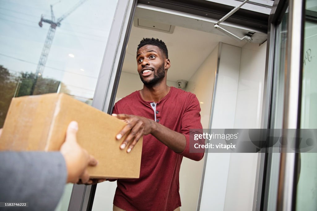 Man Receiving a Parcel