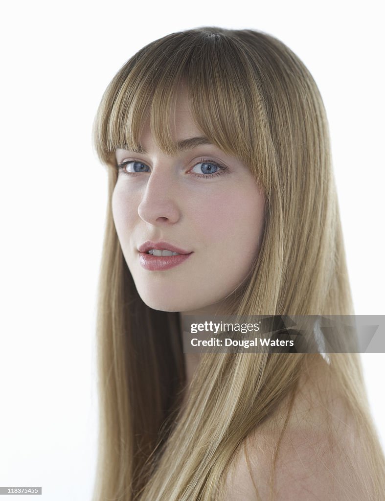 Portrait of woman on white background.
