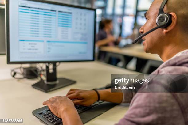 man working at a call center - dispatch computer screen stock pictures, royalty-free photos & images