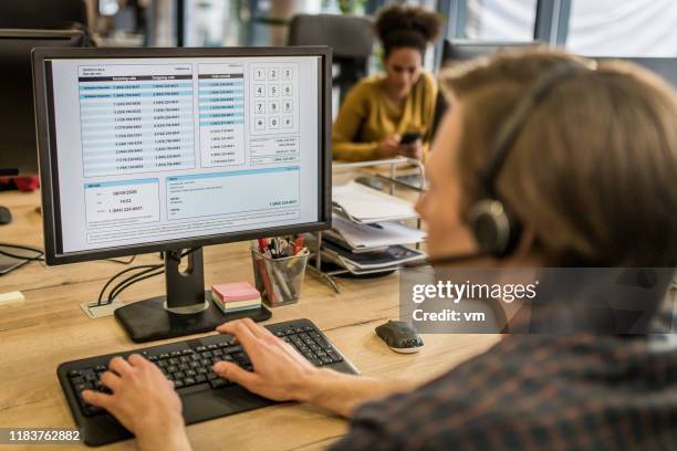 man working in a call center - dispatch computer screen stock pictures, royalty-free photos & images