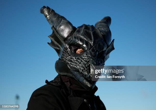 Man wears an extravagant mask as he attends Whitby Goth Weekend on October 27, 2019 in Whitby, England. The Whitby Goth weekend began in 1994 and...