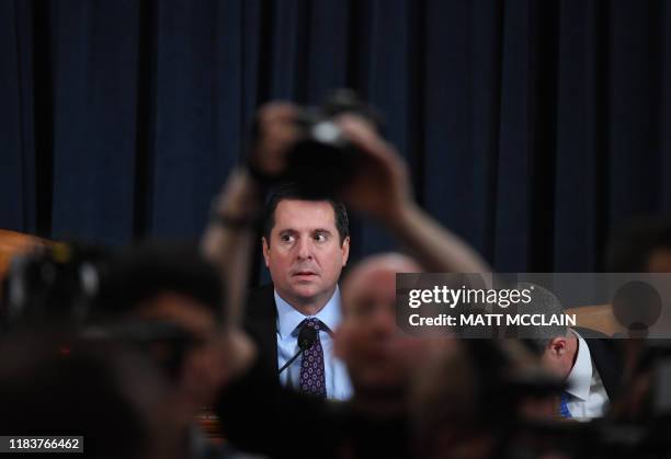 Ranking Member Devin Nunes looks on, as Fiona Hill, the former top Russia expert on the National Security Council, and David Holmes, a State...