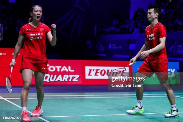 Zheng Siwei and Huang Yaqiong of China react in the Mixed Double final match against Praveen Jordan and Melati Daeva Oktavianti of Indonesia on day...