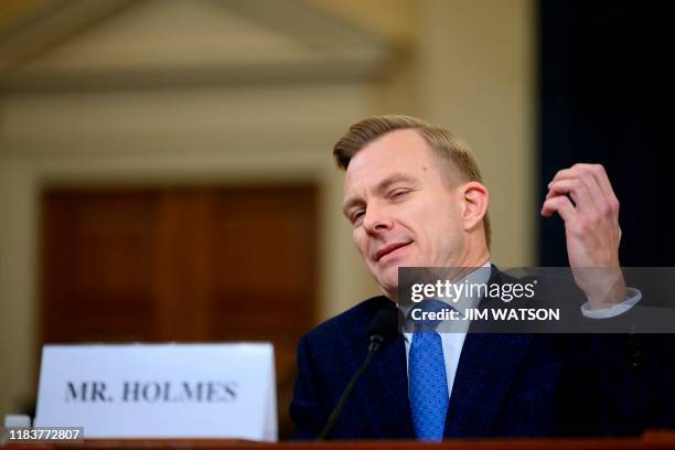 David Holmes, a State Department official stationed at the US Embassy in Ukraine testifies during the House Intelligence Committee hearing as part of...