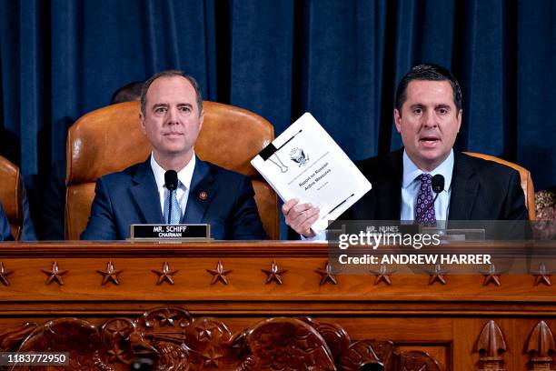 House Intelligence Committee chair, Adam Schiff looks on as Ranking Member Devin Nunes submits a report on the Russian interference in the 2016...