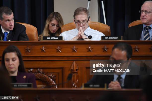 Representative Jim Jordan , listens as Fiona Hill, the former top Russia expert on the National Security Council, and David Holmes, a State...