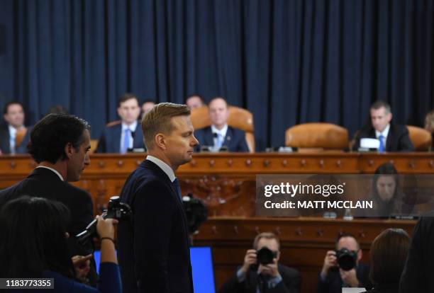 David Holmes, a State Department official stationed at the US Embassy in Ukraine leaves during a break during the House Intelligence Committee...