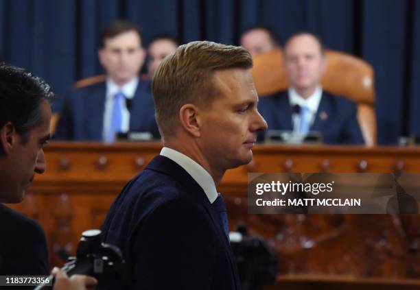 David Holmes, a State Department official stationed at the US Embassy in Ukraine leaves during a break during the House Intelligence Committee...