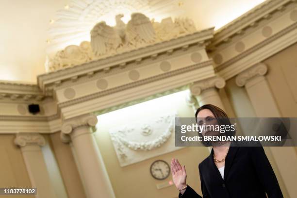 Fiona Hill, the former top Russia expert on the National Security Council, is sworn-in before she testifies during the House Intelligence Committee...