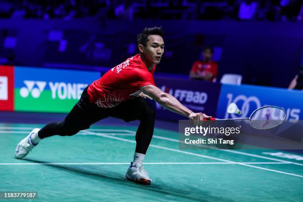 Jonatan Christie of Indonesia competes in the Men's Single final match against Chen Long of China on day six of the French Open at Stade Pierre de...