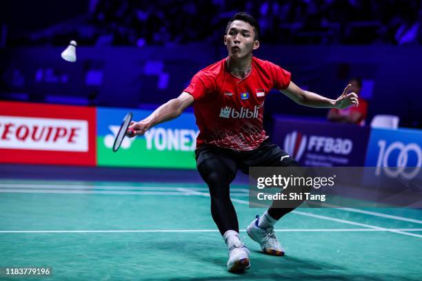 Jonatan Christie of Indonesia competes in the Men's Single final match against Chen Long of China on day six of the French Open at Stade Pierre de...