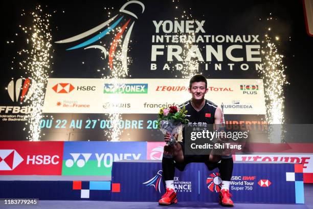 Chen Long of China poses with his trophy after the Men's Single final match against Jonatan Christie of Indonesia on day six of the French Open at...