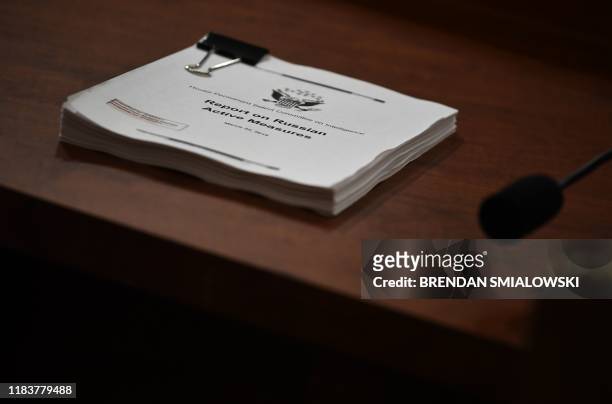 Copy of the "Report on the Russian Active Measures" is viewed during the testimony of Fiona Hill, the former top Russia expert on the National...