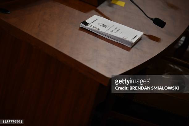 Copy of the "Report on the Russian Active Measures" is viewed during the testimony of Fiona Hill, the former top Russia expert on the National...