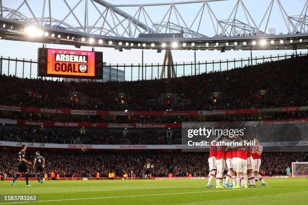 General view as Sokratis Papastathopoulos of Arsenal celebrates with team mates after scoring their team's first goal during the Premier League match...