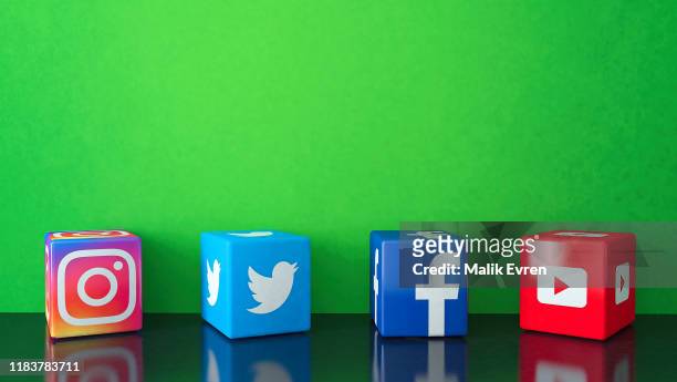 marble cubic social media services icons on black glass with green copy space - big tech stock pictures, royalty-free photos & images