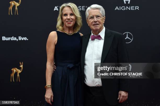 German radio and television presenter Frank Elstner and his wife Britta Gessler pose on the red carpet before the Bambi media prize ceremony on...