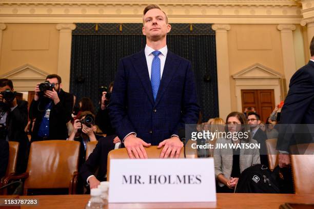 David Holmes, a State Department official stationed at the US Embassy in Ukraine returns from a break, to testify during the House Intelligence...