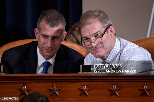 Representative Jim Jordan,, talks to Steve Castor, general counsel for the Oversight and Government Reform Committee as Fiona Hill, the former top...