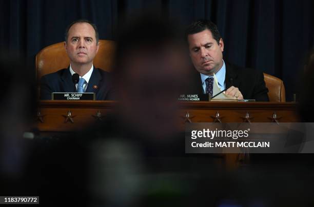 House Intelligence Committee chair, Adam Schiff and US Representative Devin Nunes R-CA listen as Fiona Hill, the former top Russia expert on the...