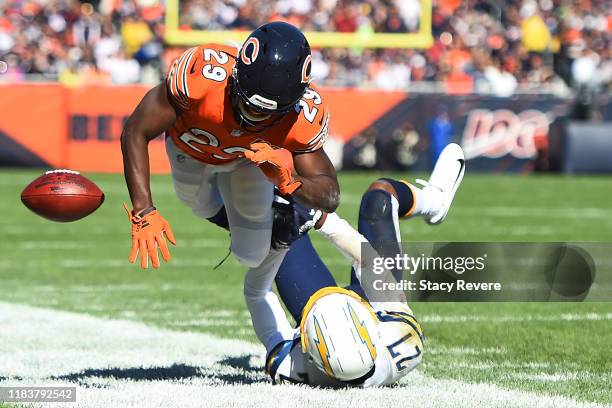 Tarik Cohen of the Chicago Bears is brought down by Jaylen Watkins of the Los Angeles Chargers during the first quarter of a game at Soldier Field on...