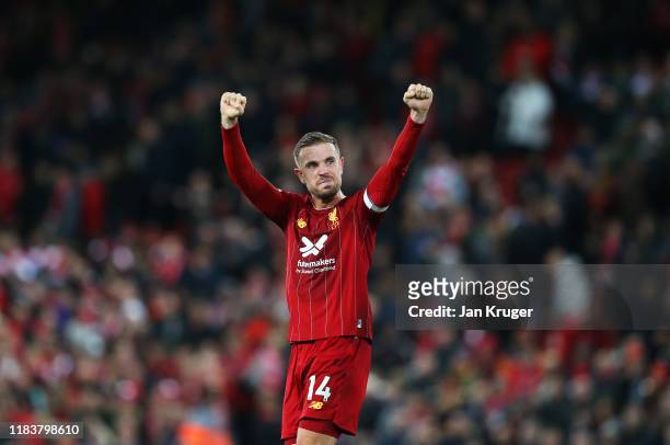 Jordan Henderson of Liverpool celebrates victory after the Premier League match between Liverpool FC and Tottenham Hotspur at Anfield on October 27,...