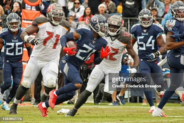 Malcolm Butler of the Tennessee Titans carries the ball after making an interception against the Tampa Bay Buccaneers during the first half at Nissan...