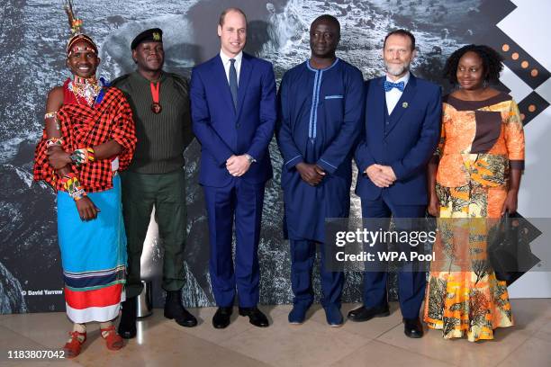 Prince William, Duke of Cambridge poses with the winners and finalists: Jeneria Lekilelei, Benson Kanyembo, Tomas Diagne, Carlos Lopes Pereira and...