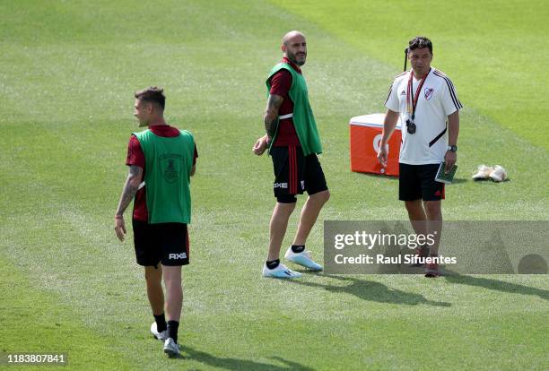 Marcelo Gallardo coach of River Plate talks to Javier Pinola of River Plate during a training session at Alejandro Villanueva Stadium on November 21,...