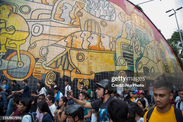 Opposition take part in a march called by university students to protest against Venezuela's President Nicolas Maduro in Caracas on November 21, 2019.