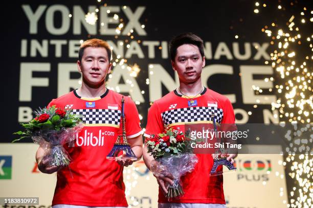 Marcus Fernaldi Gideon and Kevin Sanjaya Sukamuljo of Indonesia pose with their trophies after the Men's Double final match against Satwiksairaj...